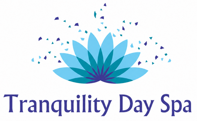 Logo of Tranquility Day Spa with a blue lotus flower design on a white background